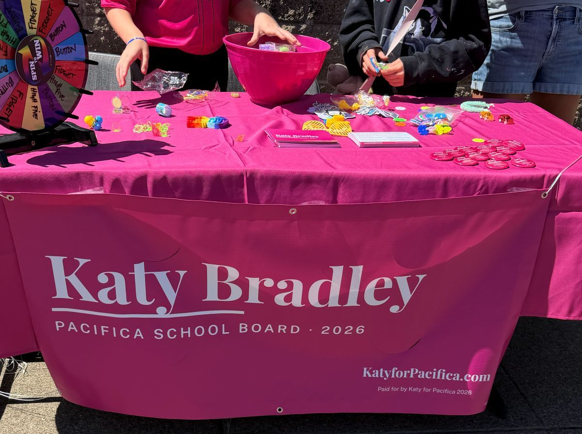 Katy Bradley campaign table and banner at Safeway